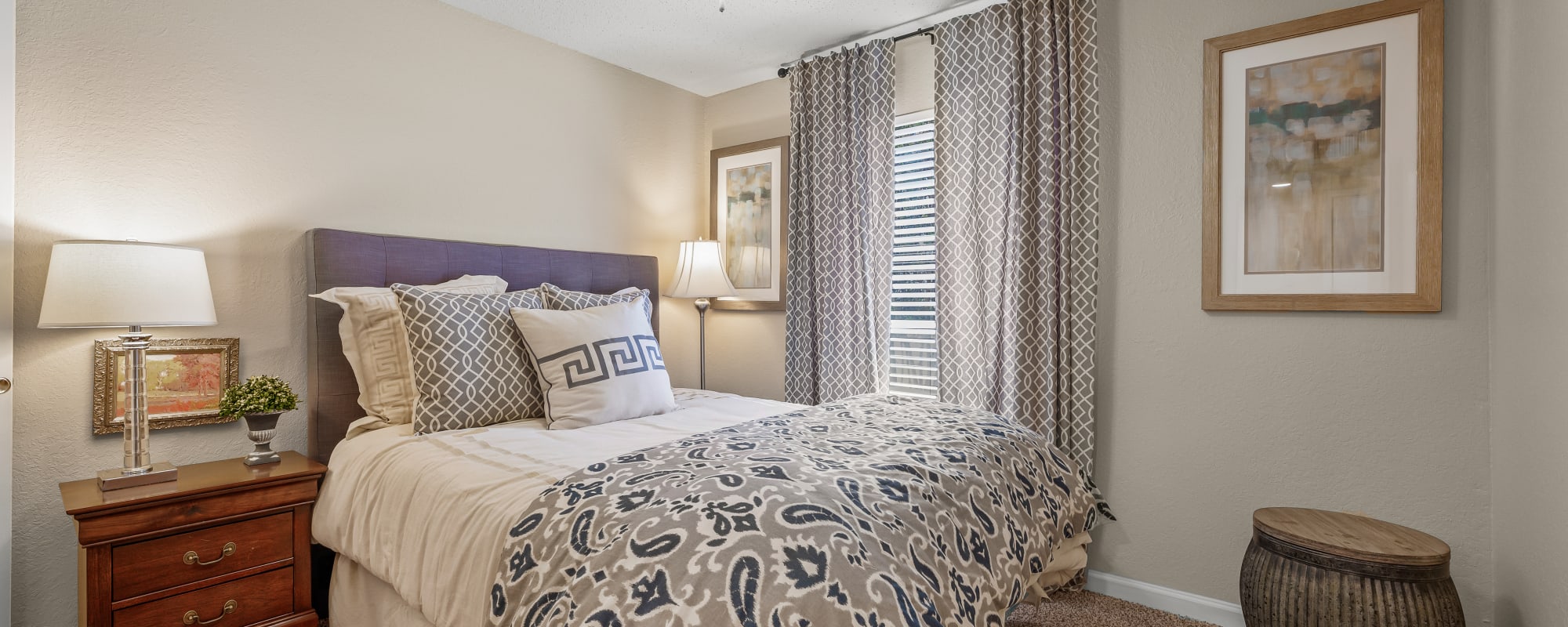 Bedroom with carpet flooring and window at Millicent Crossing in Shreveport, Louisiana