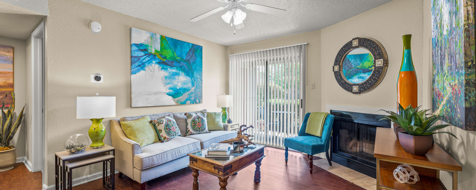 Living room with access to balcony  at Millicent Crossing in Shreveport, Louisiana