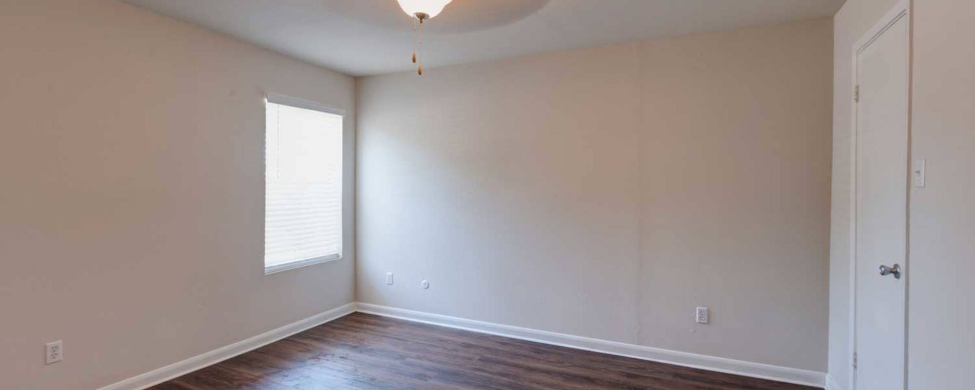 Bedroom with hardwood floors at Meyerland Court in Houston, Texas
