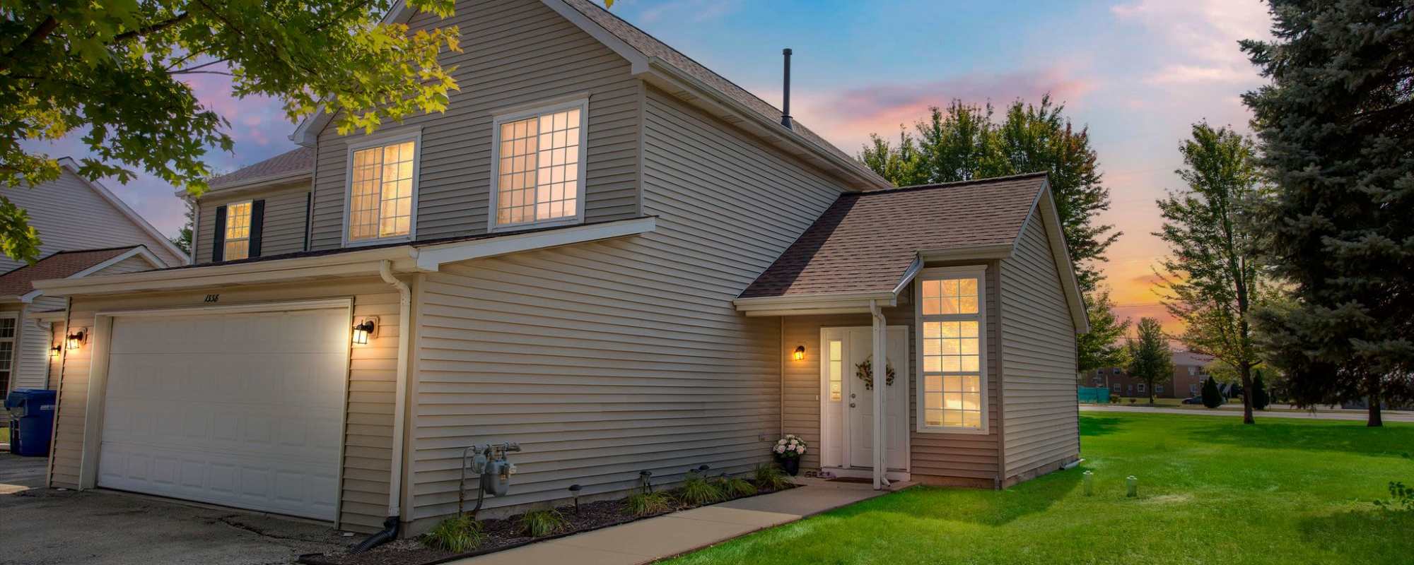 Exterior view at night at  Meadowlark Townhomes in Dekalb, Illinois