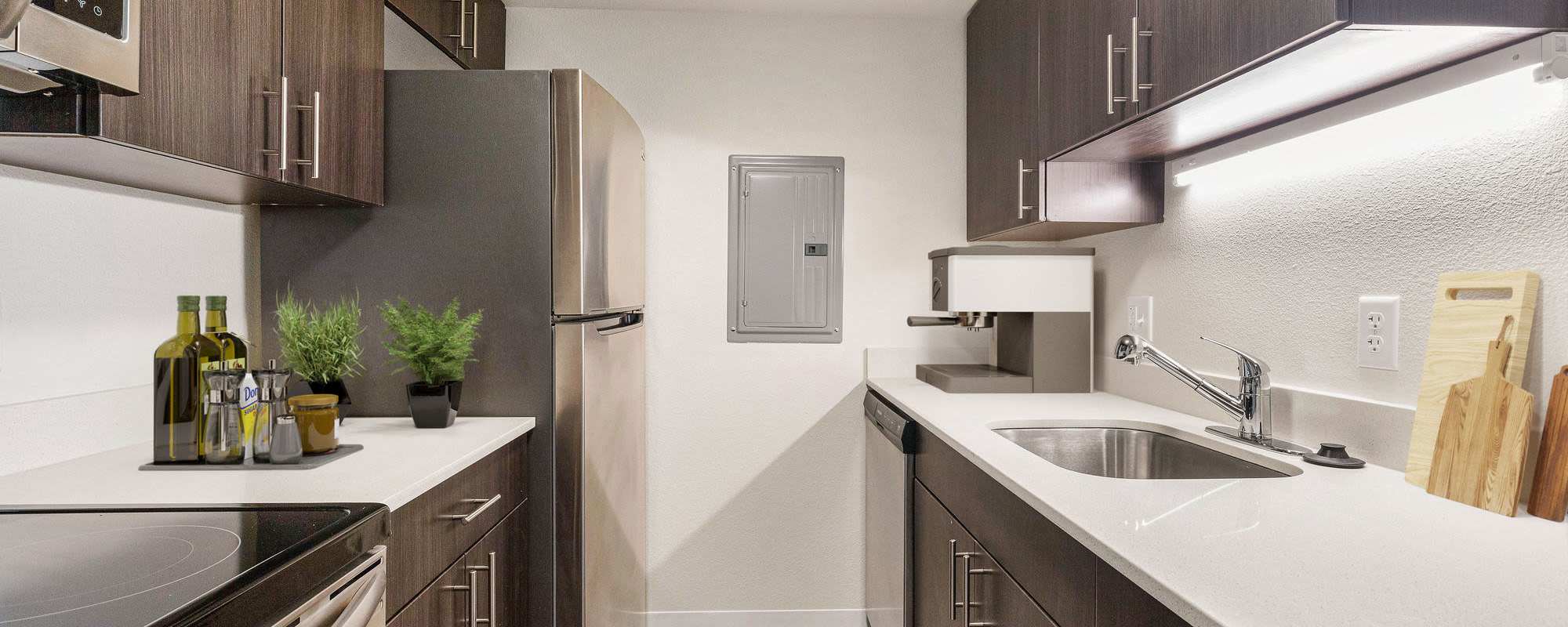 Cozy apartment with white quartz countertop and stainless-steel appliances at The Windermere in Littleton,Colorado