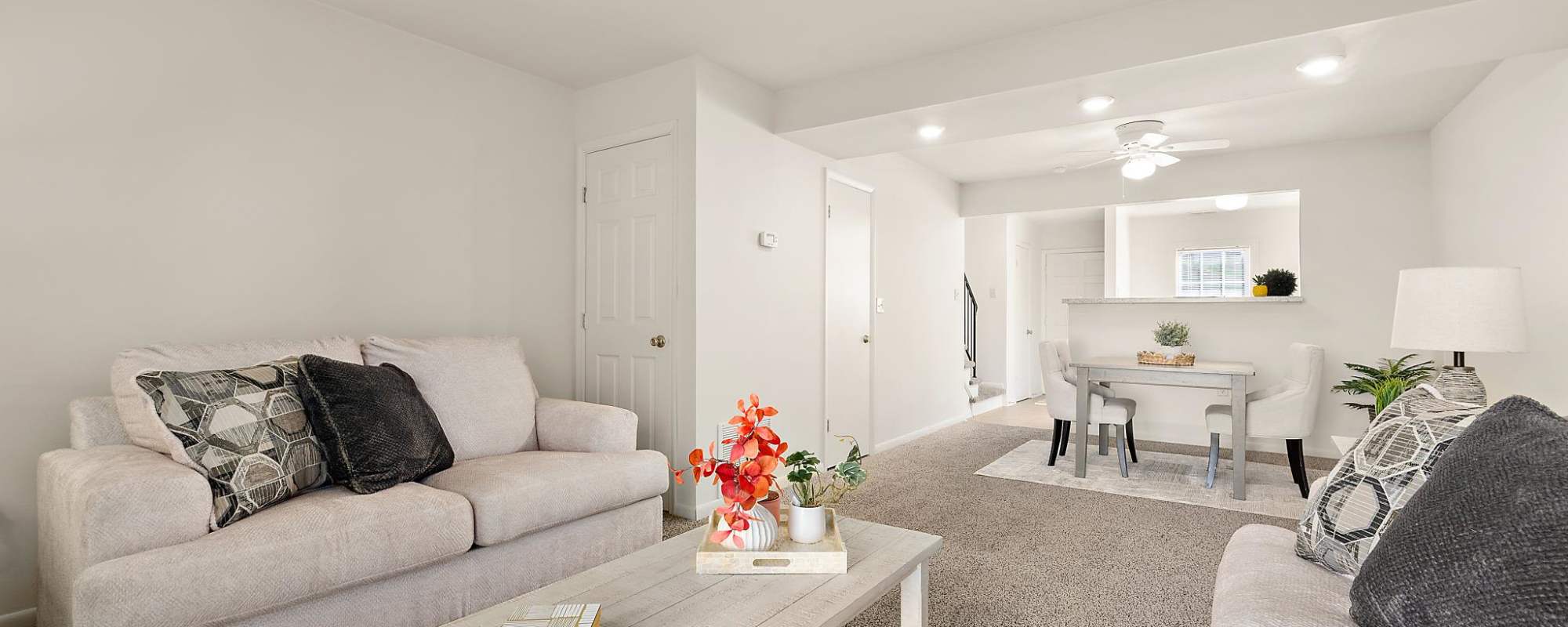 Living space with plush carpeting at Oak Hill in Salisbury, Maryland