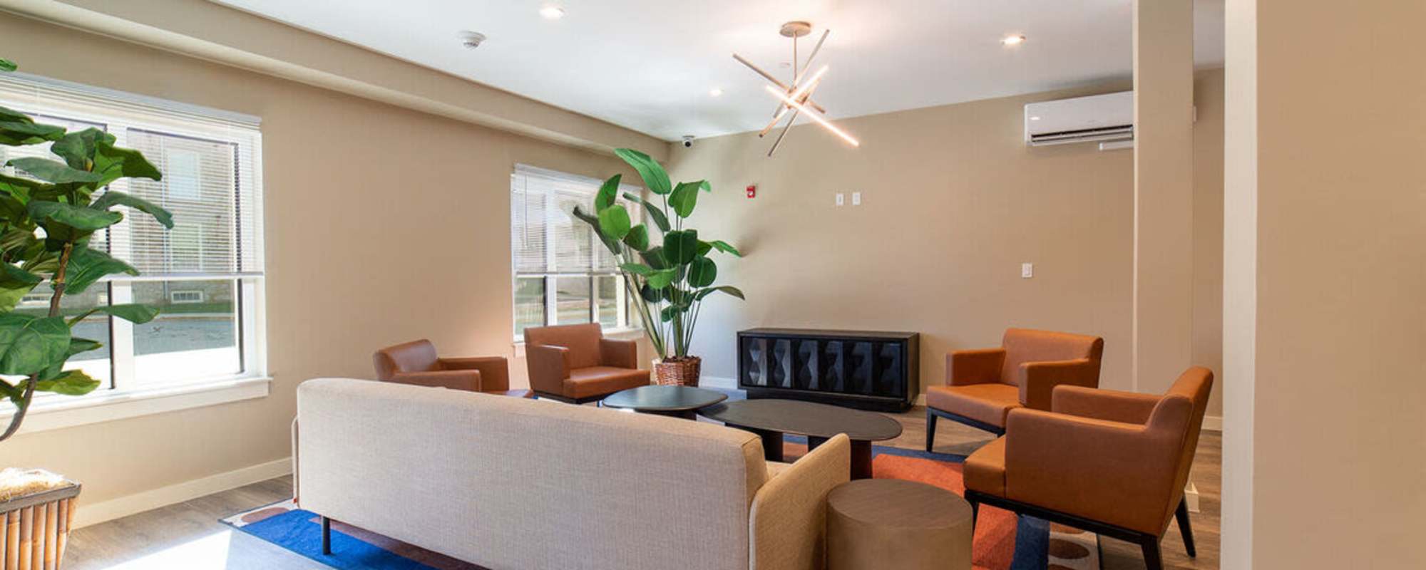 Clubhouse with a couch, multiple armchairs at Solara in Tiverton, Rhode Island