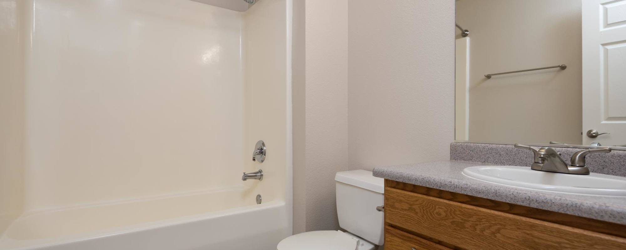 Bathroom with bathtub at Chinook Way Apartments in Fairview, Oregon