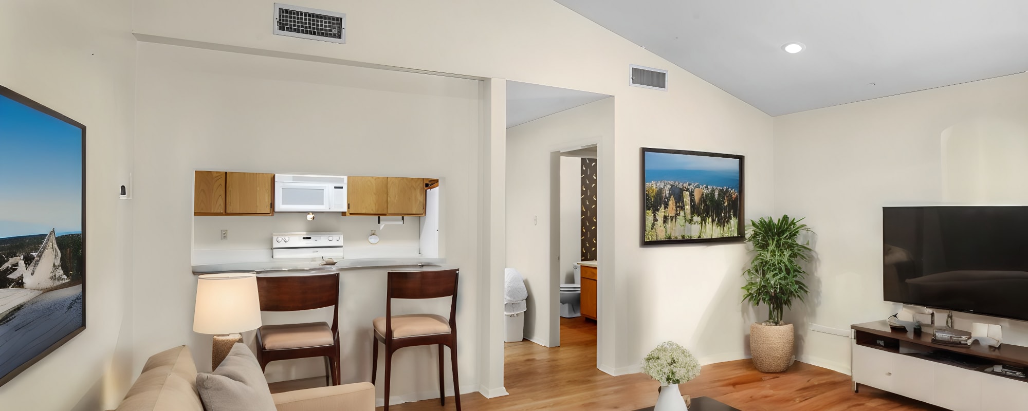 Living room with television with view to kitchen at Country Club Place in Marshall, Texas
