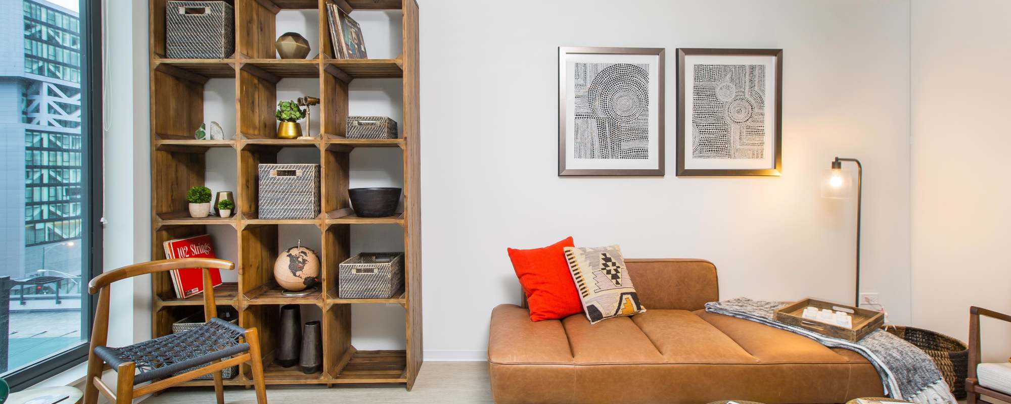 Large window in the living room and couch at Exhibit On Superior in Chicago, Illinois