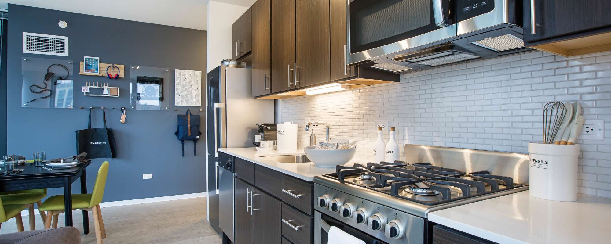 Kitchen with upscale appliances at Exhibit On Superior in Chicago, Illinois