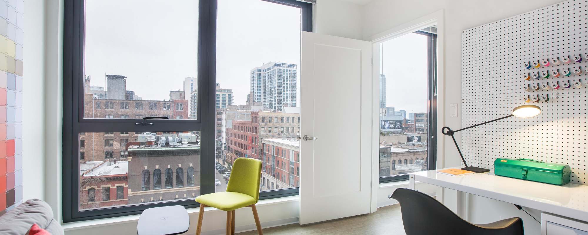 Second bedroom with large windows at Exhibit On Superior in Chicago, Illinois