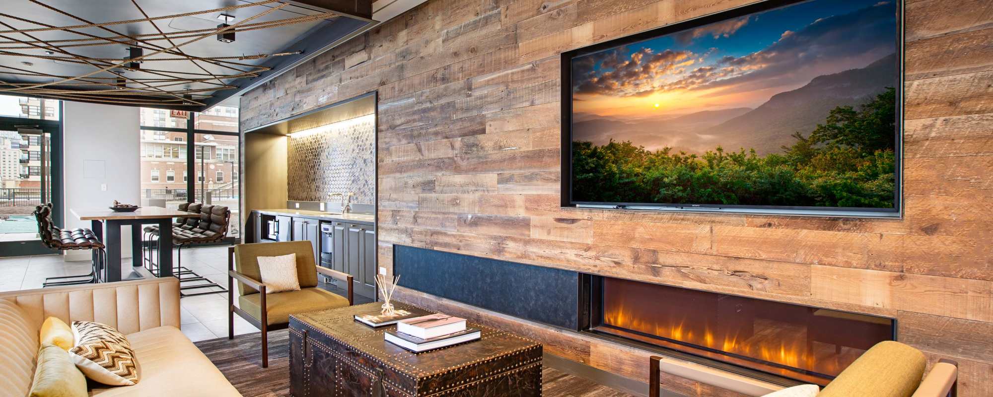 Resident lounge with fireplace at Exhibit On Superior in Chicago, Illinois