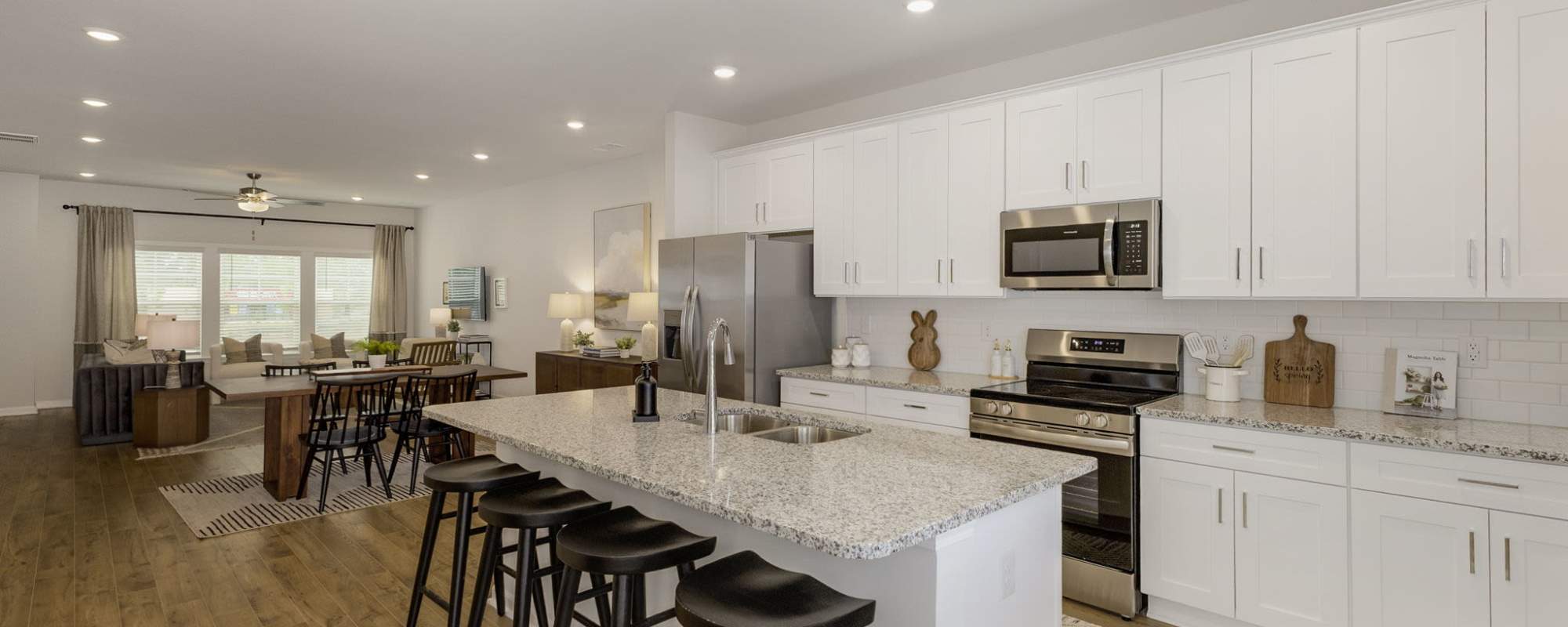 Kitchen island and dining area The Courts at Maverick Yards in Mauldin, South Carolina