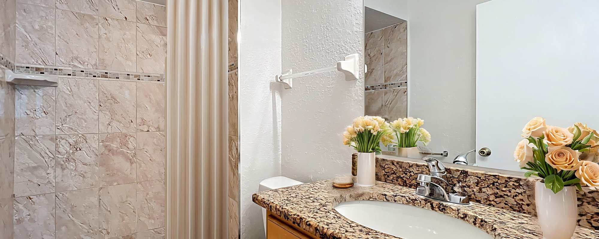Bathroom with big mirrors at Images Condominiums in Kissimmee, Florida