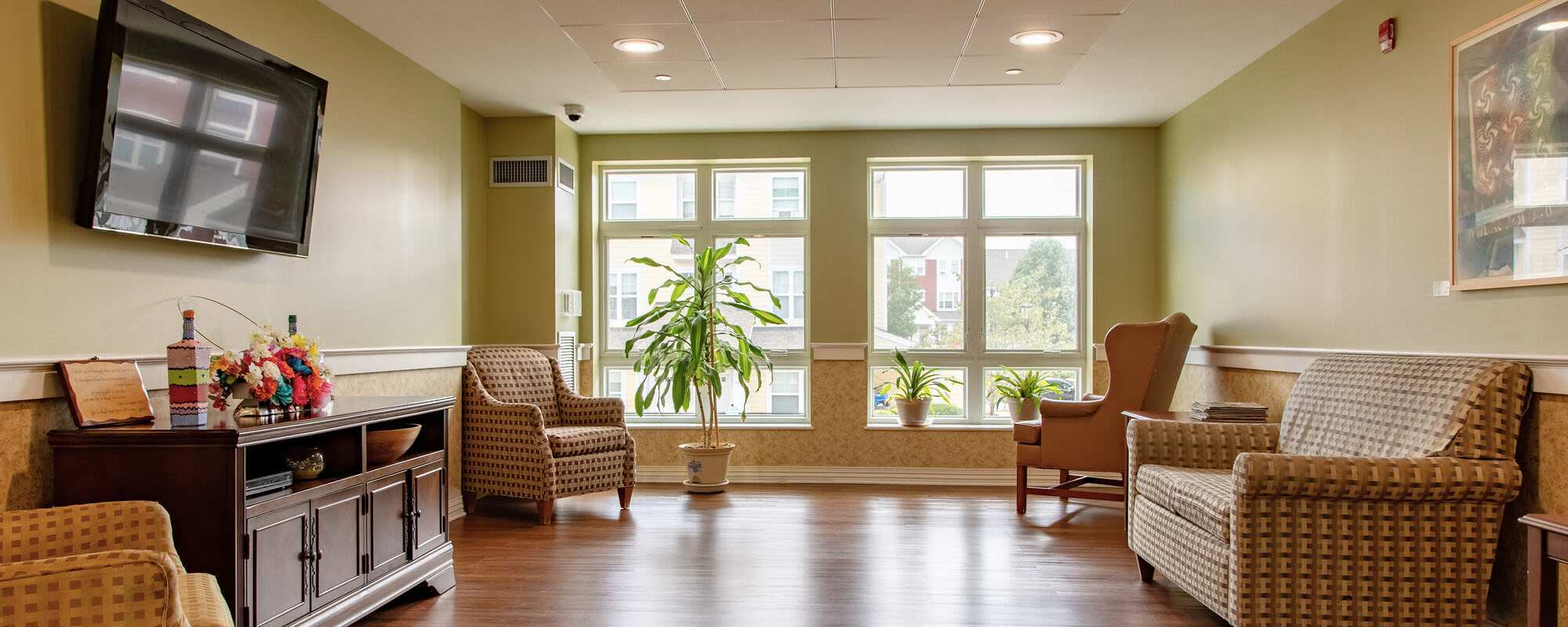 Well-lit room at Hearth at Olmsted Green in Dorchester. MA