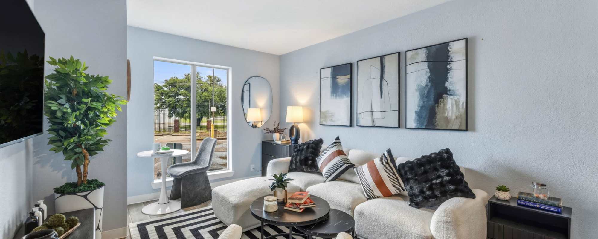 Well-lit living room at The Nora in Dallas, Texas
