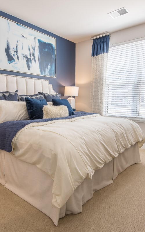 Cozy bedroom in a model home at Mayfair Reserve in Wauwatosa, Wisconsin