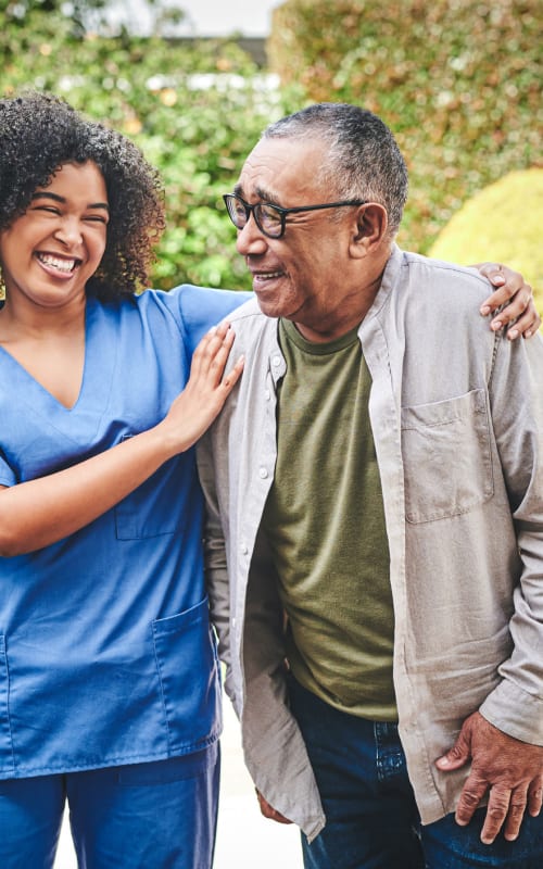 Resident walking with a nurse at Parkview Estates in Kennewick, Washington