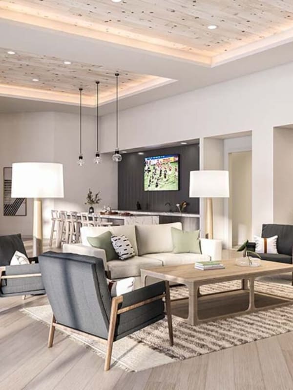 Well lit open floor plan living room at The Kelvin in Huntsville, Alabama