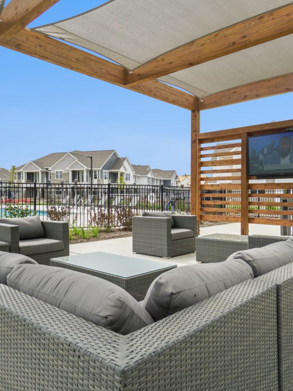Outdoor lounge with a tv at Seasons at Franklin in Franklin, Wisconsin