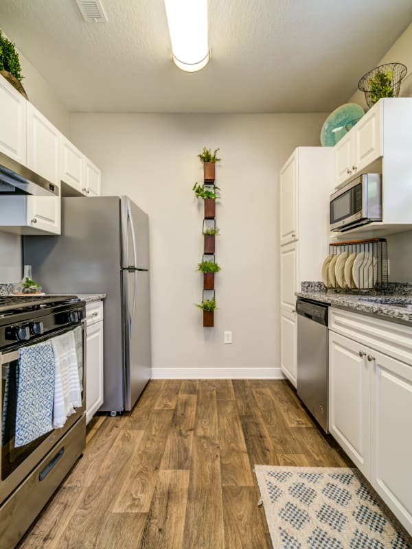 Spacious kitchen with hardwood flooring in a model home at Reserve at Biltmore Park in Arden, North Carolina