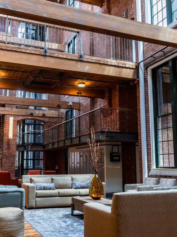 Tall ceilings and exposed brick in the clubhouse at Abbot Mill in Westford, Massachusetts