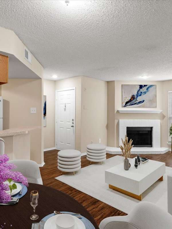 Living room with a fireplace at Pear Ridge in Dallas, Texas