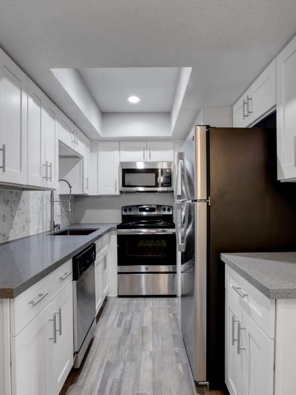 Stainless-steel appliances in and apartment kitchen at Cascade Apartments in Henderson, Nevada