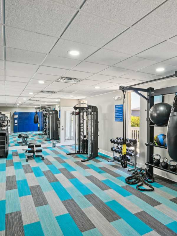 Well-equipped fitness center at Amber Grove Apartment Homes in Marietta, Georgia