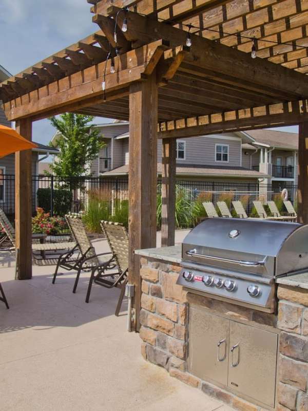 Outdoor BBQ area at The Manor Homes of Eagle Glen in Raymore, Missouri