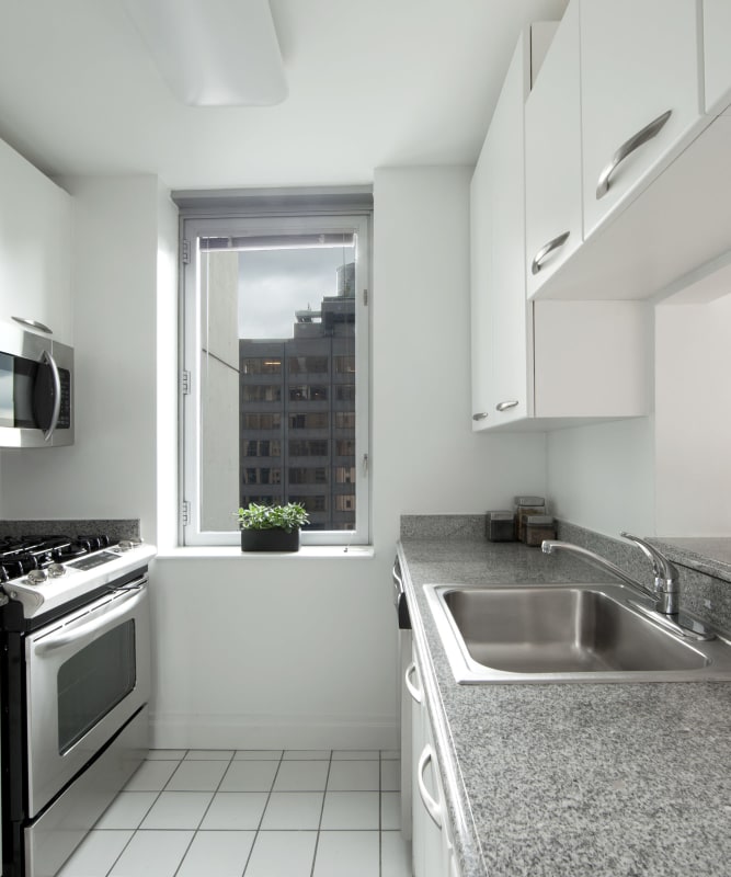 A kitchen with tile flooring at The Metropolis in New York, New York