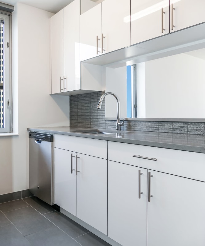 A kitchen with modern cabinets at The Metropolis in New York, New York