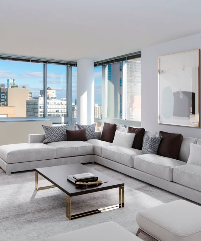 A spacious living room with lots of windows at The Metropolis in New York, New York