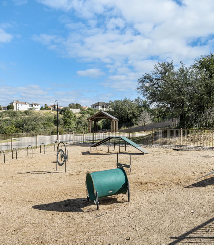 Agility equipment in the onsite dog park at The Residences at Panther Hollow in Marble Falls, Texas