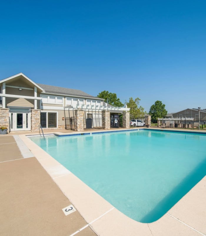 Sparkling pool and sundeck outside of Regency Point Apartments in Tulsa, Oklahoma