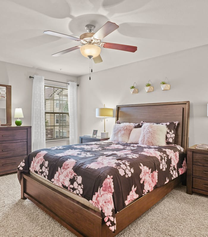 Chic bedroom with ceiling fan at Tuscany Place in Lubbock, Texas