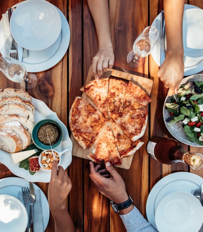 Residents sharing a pizza near Chisholm Pointe in Oklahoma City, Oklahoma