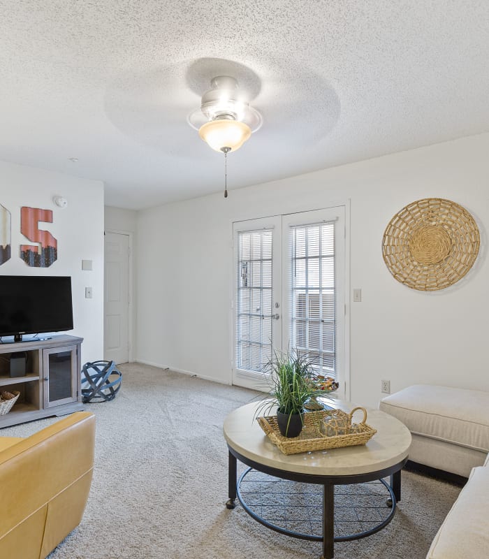 Spacious living room with large windows at Cimarron Trails Apartments in Norman, Oklahoma