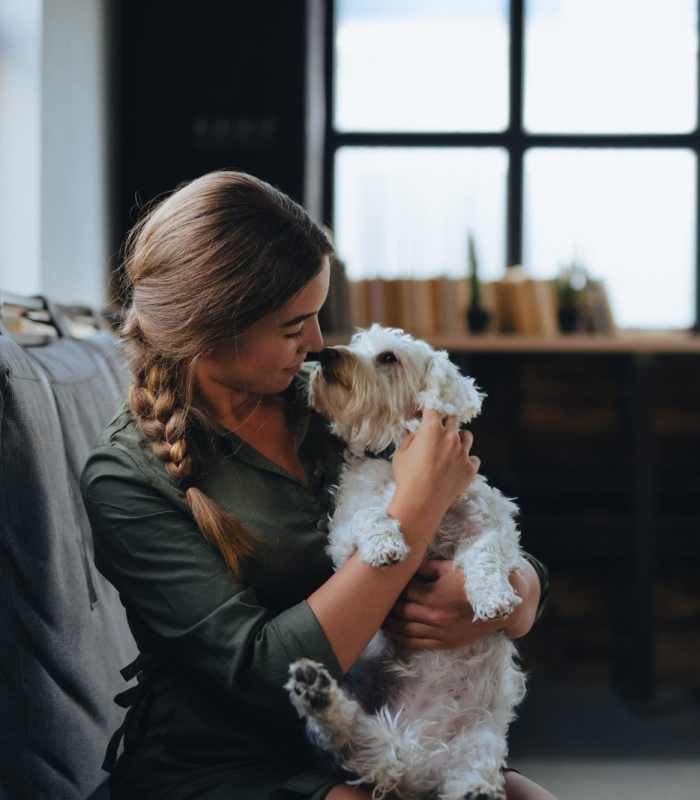 Woman holding her dog at Lake House in Los Angeles, California