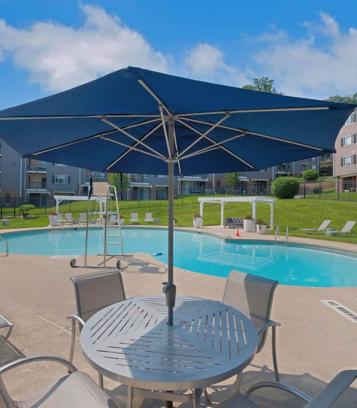 Swimming pool area on a sunny day at Eagle Rock Apartments at Towson in Towson, Maryland