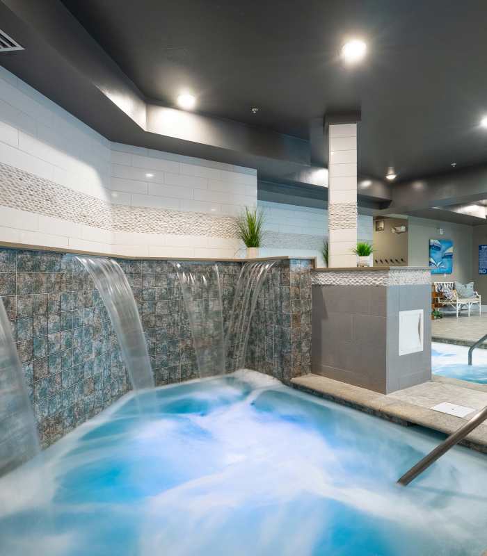 Resident soaking in the hot tub at Novus Westshore in Tampa, Florida