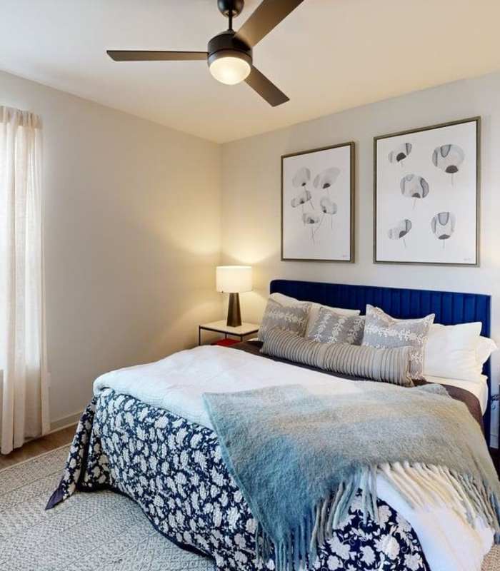 Residents spending time beside pool at Silo Creek Apartments in Lafayette, Louisiana