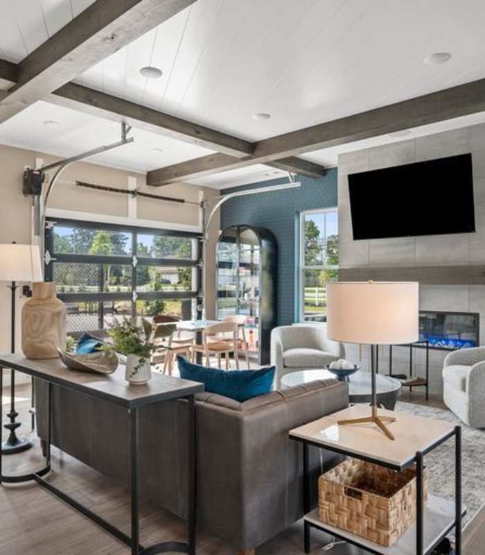 Interior of future clubhouse - large sofa and kitchen for guests