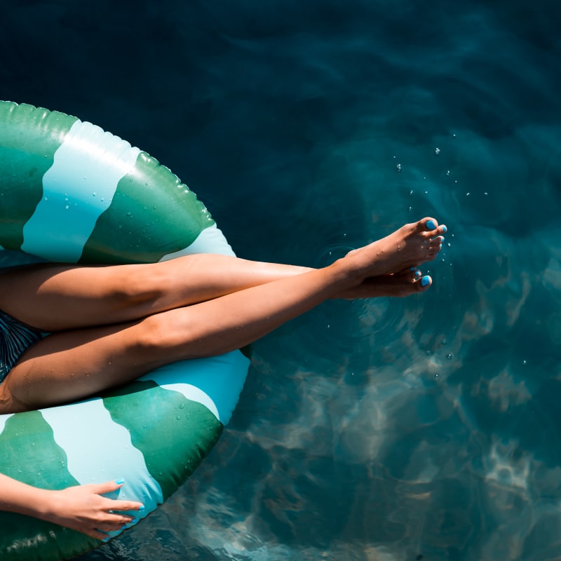 Resident enjoying the swimming pool at The Residences at Waterstone in Pikesville, Maryland