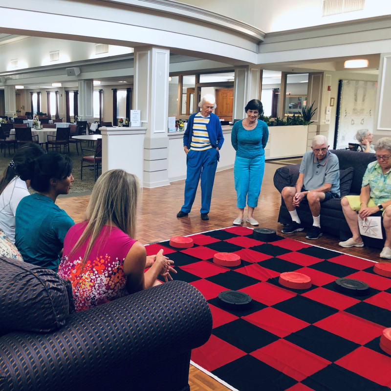 Residents playing giant checkers at The Florence Presbyterian Community in Florence, South Carolina