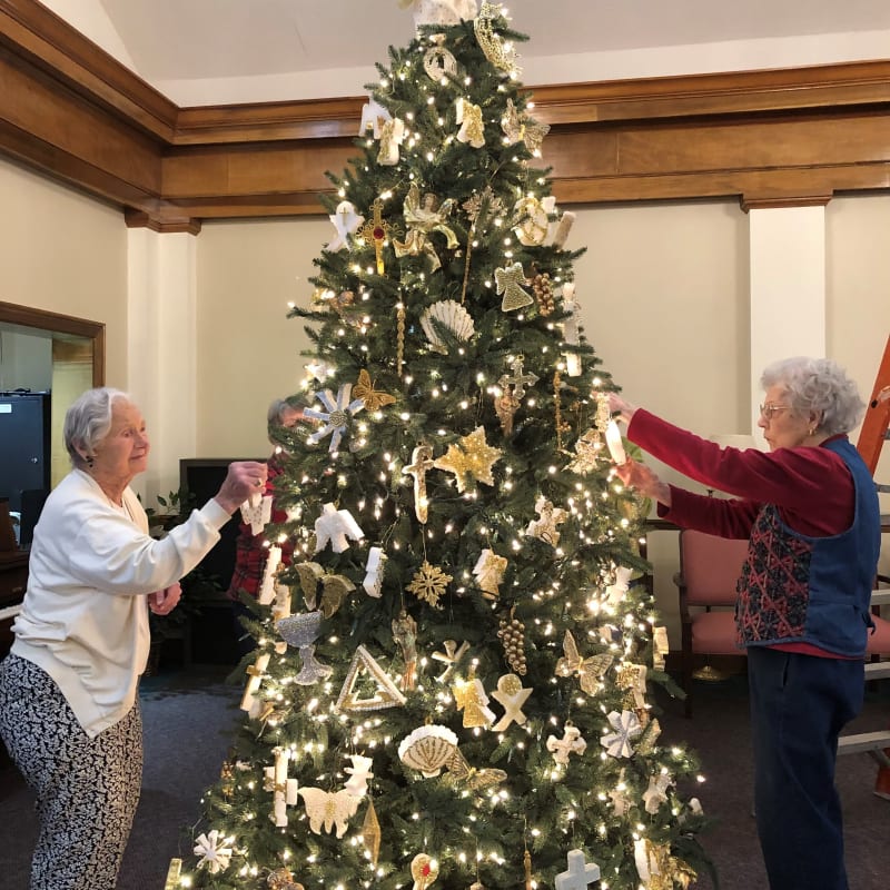 Residents decorating a tree at The Florence Presbyterian Community in Florence, South Carolina