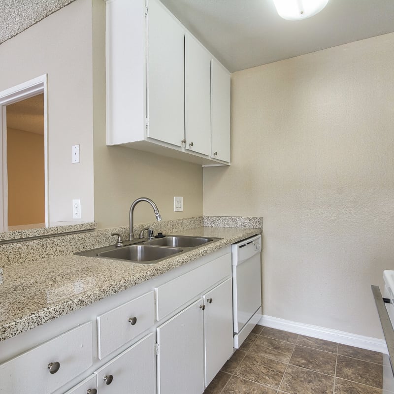 Apartment kitchen at Wallace Court Apartments in Costa Mesa, California