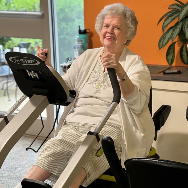 Resident on a seated eliptical at The Foothills Retirement Community in Easley, South Carolina