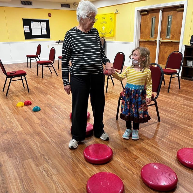 Resident exercising with a child at The Columbia Presbyterian Community in Lexington, South Carolina
