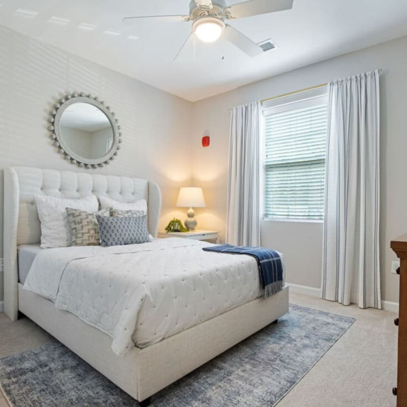 Model bedroom with white accents at Loftin I in Belmont, North Carolina