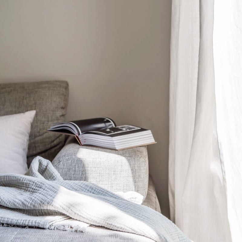 Model bedroom with book at Avion Point Apartments in Charlotte, North Carolina