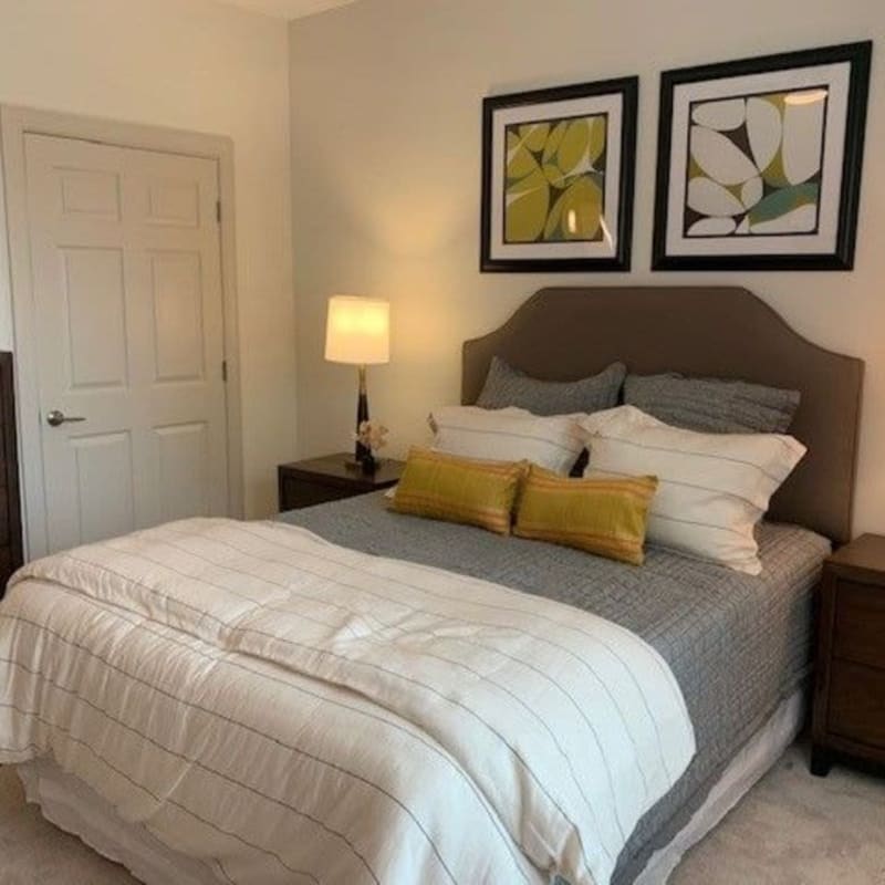 Model bedroom with wall-art at Avion Point Apartments in Charlotte, North Carolina