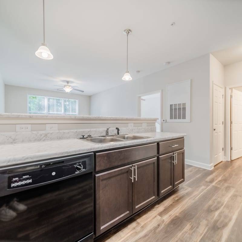 Kitchen with brown cabinets at Harmony Place in Charlotte, North Carolina